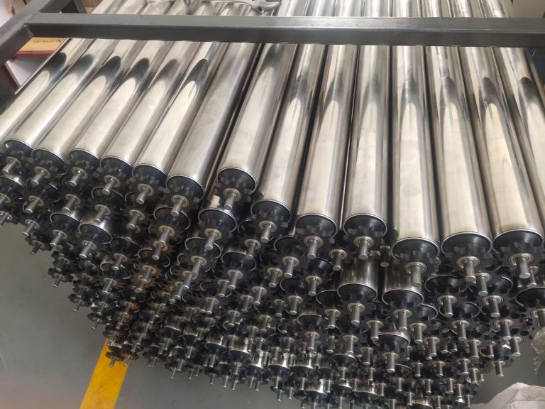 Stack of stainless steel conveyor rollers with bearing shafts